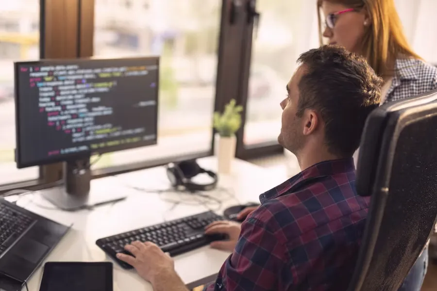 Developers working through a build together