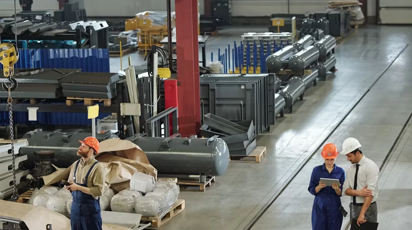 Workers and machinery on a factory floor
