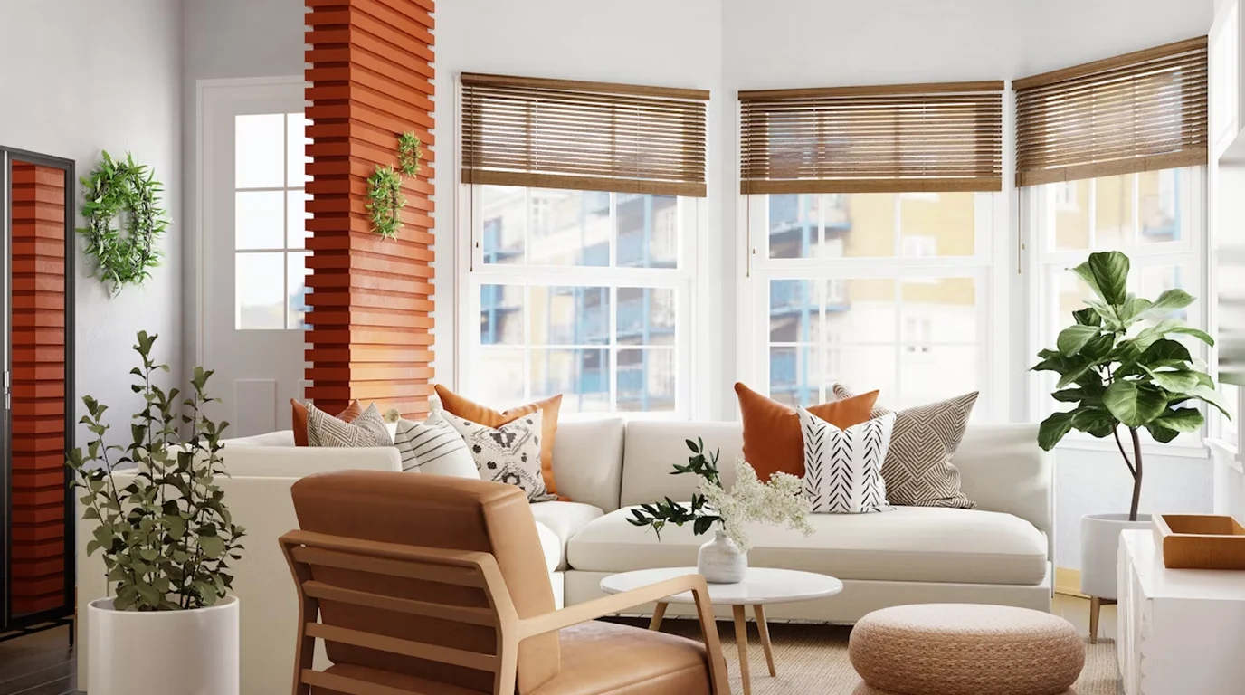 A bright, styled living room with timber shutters and plants